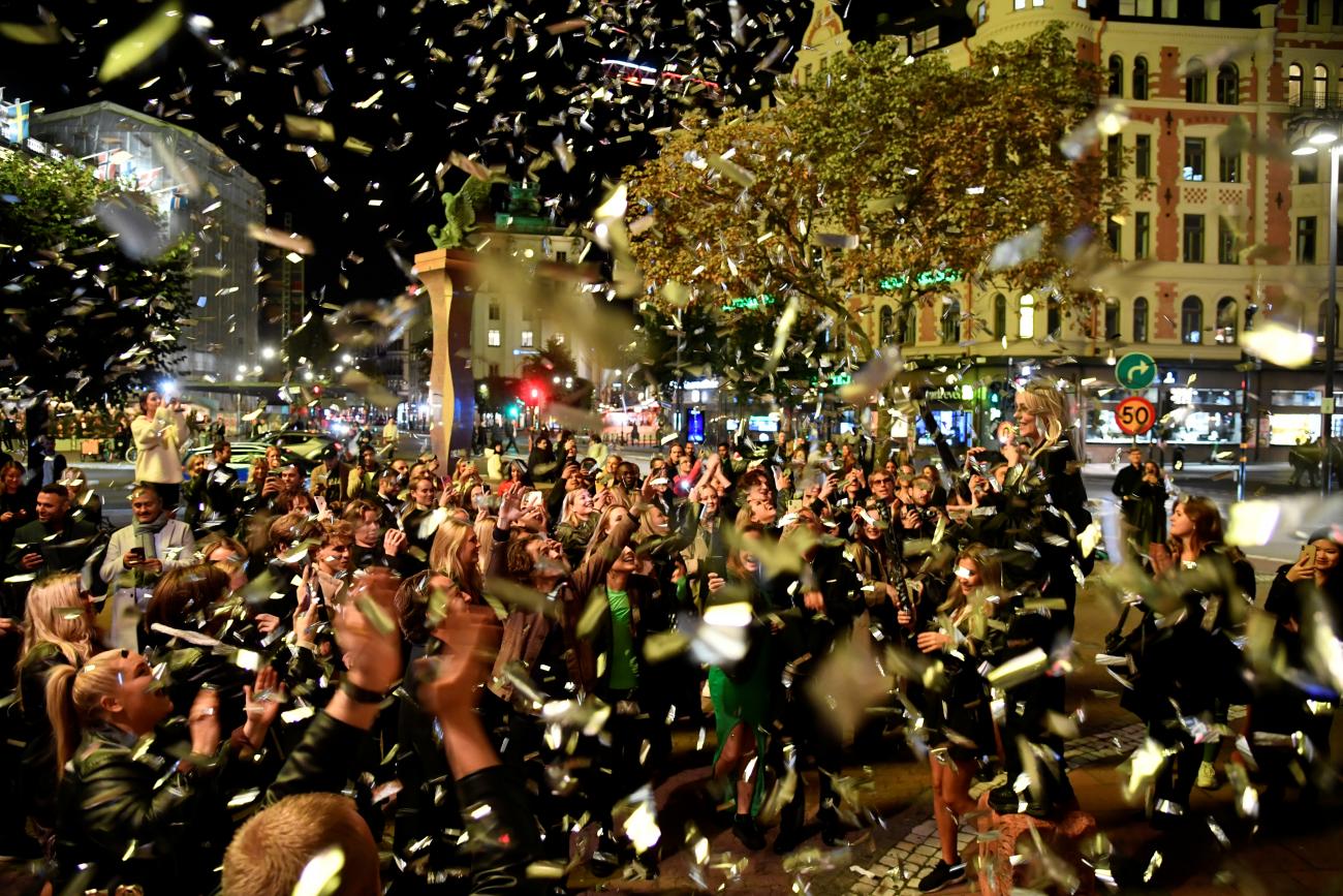 Crowds outside celebrate the end of COVID-19 restrictions at Stureplan in central Stockholm, Sweden, on September 29, 2021.