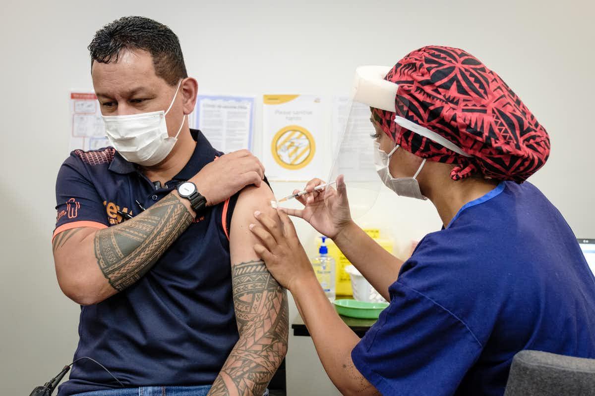 A Māori man receives his covid-19 vaccination