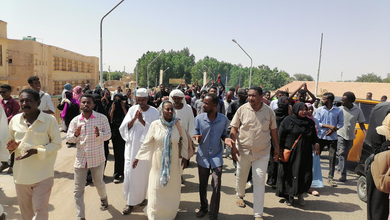 Sudanese demonstrators march and chant during a protest against the military takeover, in Atbara, Sudan, on October 27, 2021.