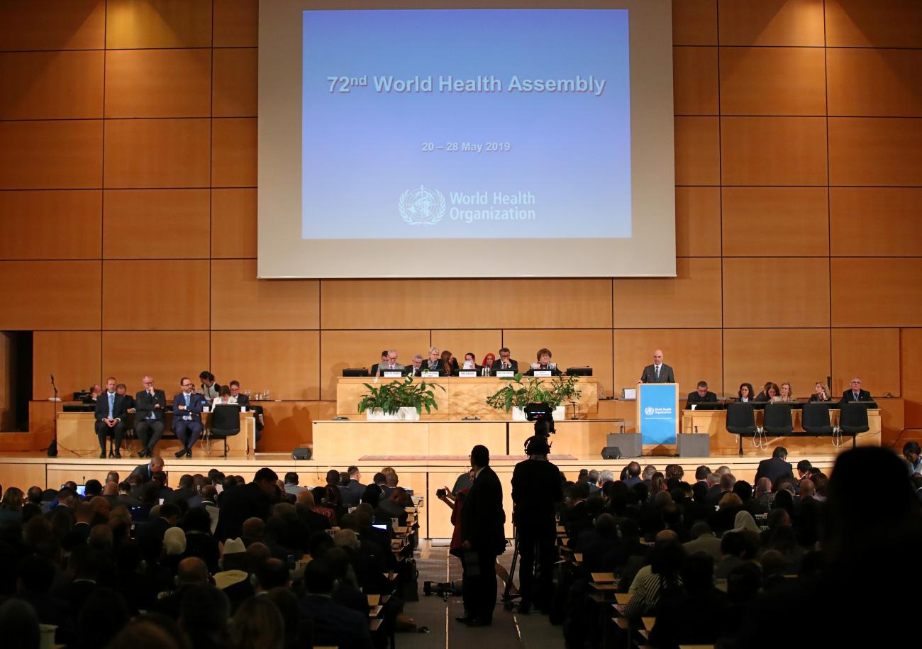 A large auditorium with people preparing for opening day of the 72nd World Health Assembly in Geneva, Switzerland, May 20, in 2019.