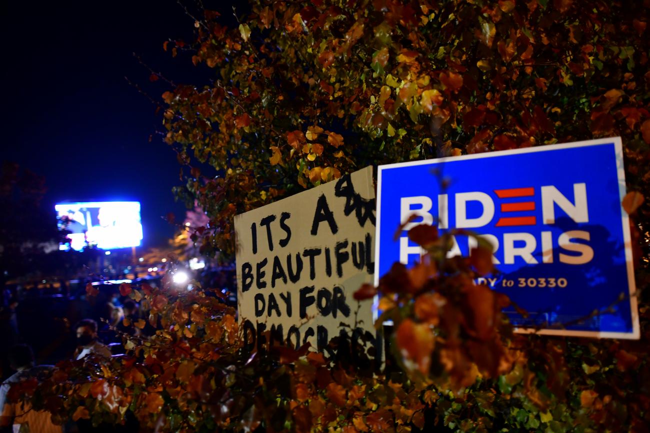 A sign reads "It's a beautiful day for democracy,” at a watch party for Joe Biden on the evening he won the 2020 U.S. presidential election, in Wilmington, Delaware, in November, 2020. 