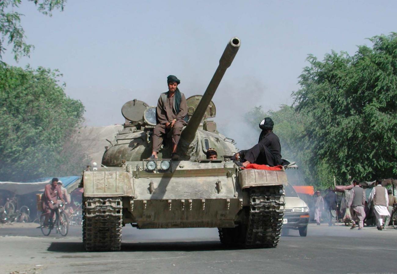A Taliban-owned tank heads toward the frontline to the north of Kabul, Afghanistan, on June 2, 2001.