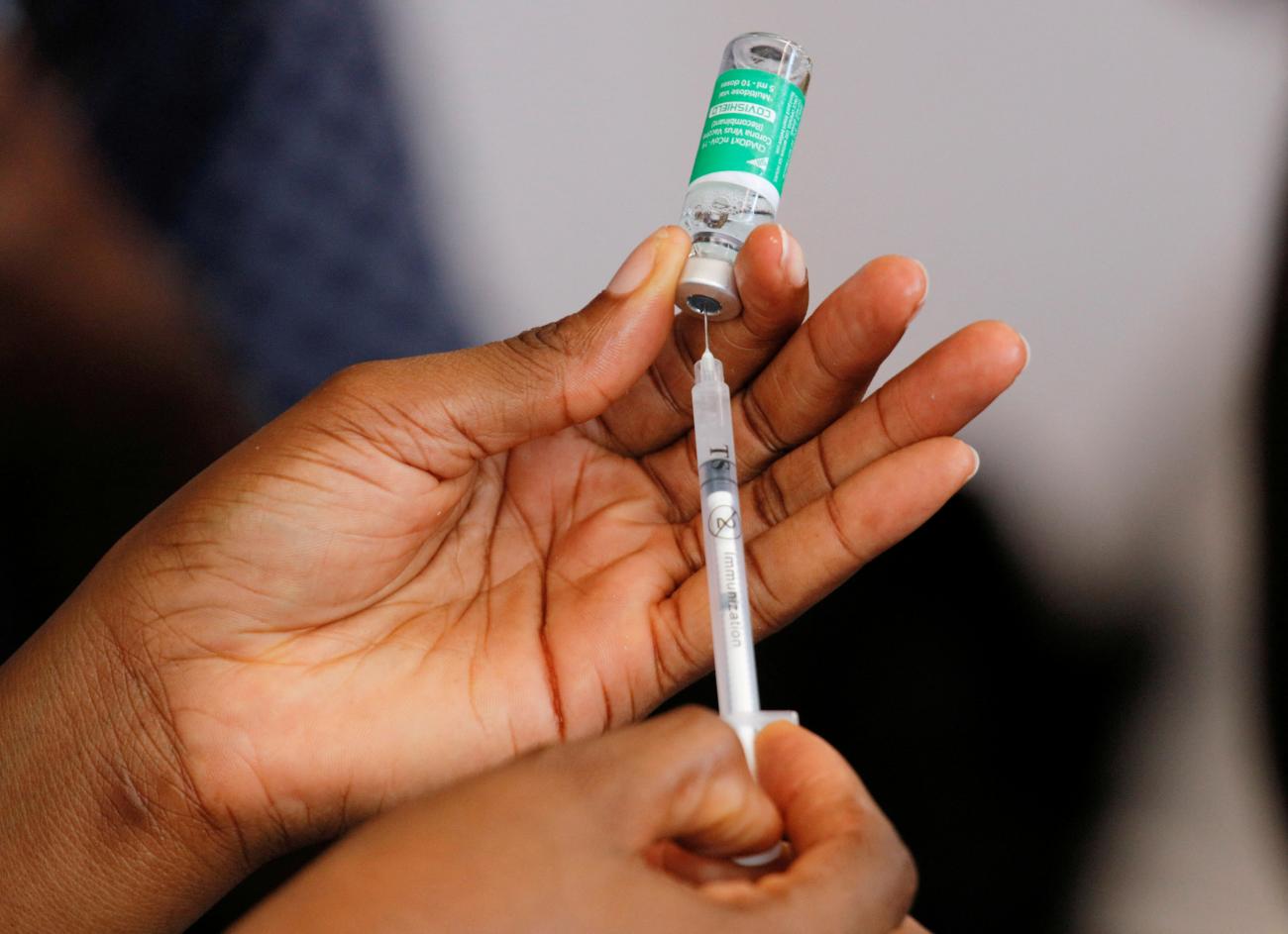 A nurse prepares a dose of the of COVID-19 vaccine during a vaccination campaign at the Ridge Hospital in Accra, Ghana, on March 2, 2021.