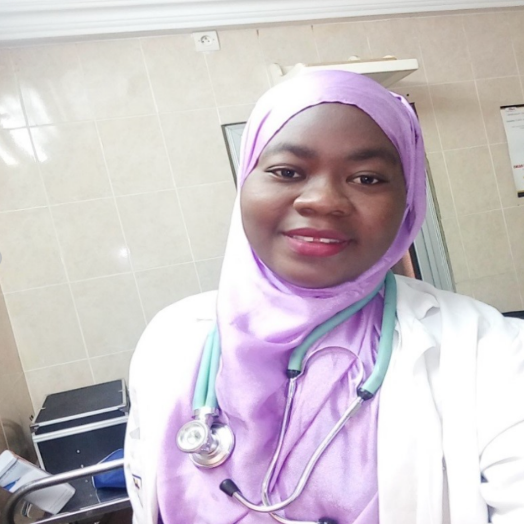 The author, Naïmatou Moussa, is a physician who works in Senegal. In the photo, she wears a stethoscope draped around her shoulders and a lavender hijab and she smiles at the camera. Dr. Moussa is currently undergoing chemotherapy for cancer.