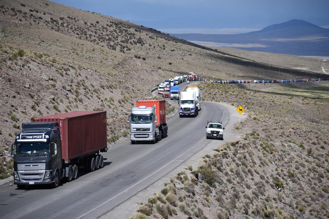 Trailer trucks are lined up on a highway near the Bolivian-Chile border as they wait for COVID-19 testing that would allow them to enter Chile. Photo taken in Tambo Quemado, Bolivia, on January 13, 2022.