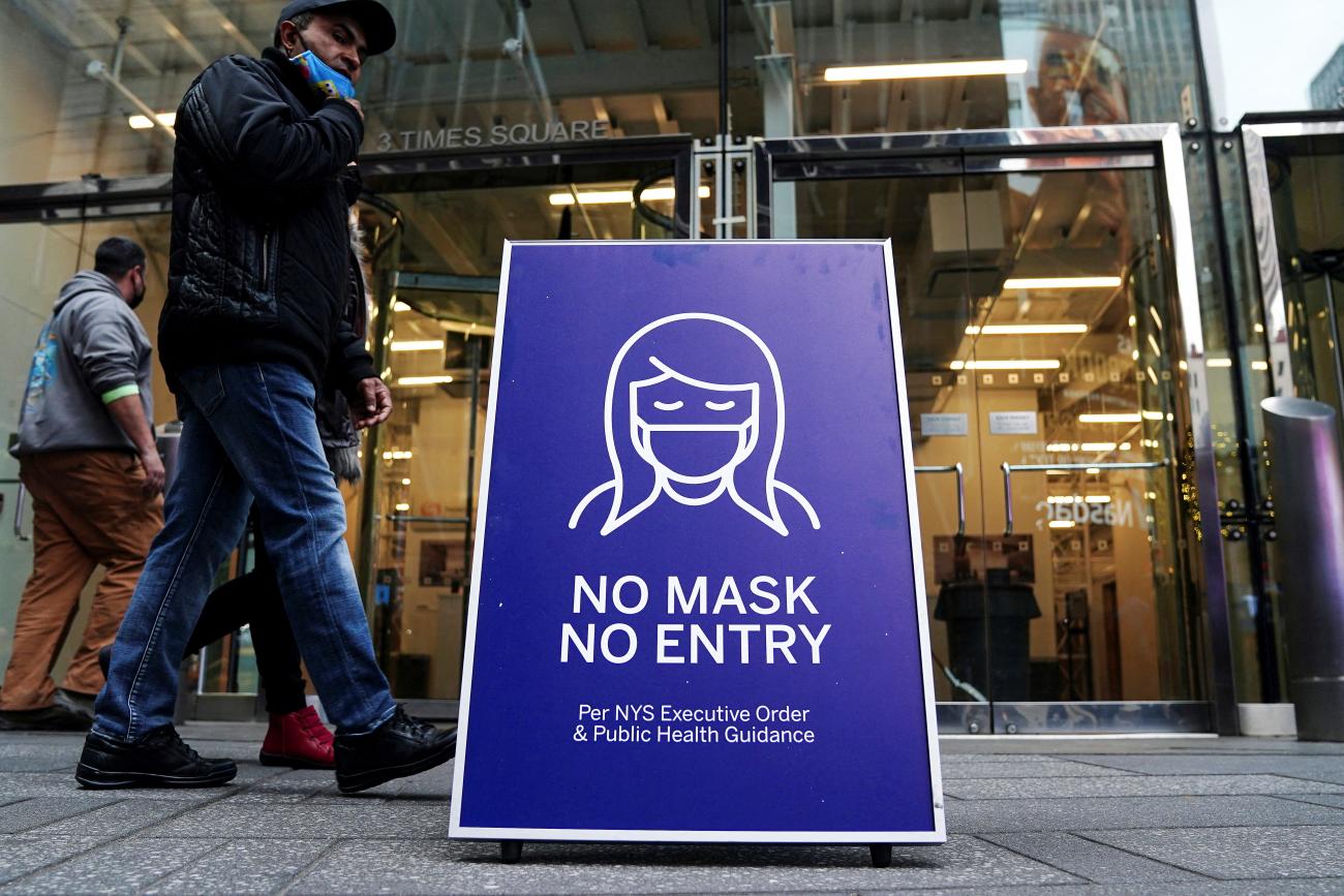 A "No Mask No Entry" sign is pictured outside a business in Times Square during the coronavirus disease (COVID-19) pandemic in the Manhattan borough of New York City, New York, on December 15, 2021.