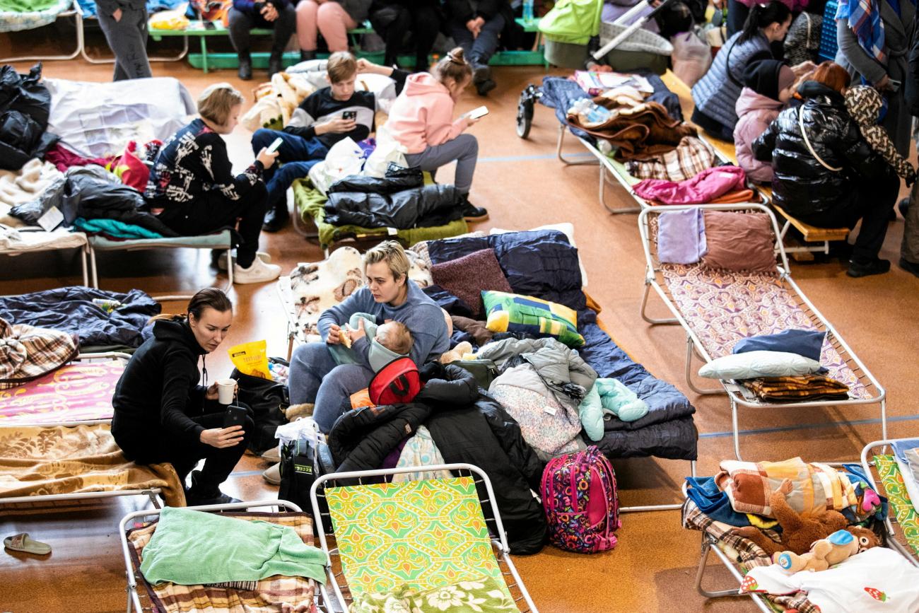 People, who fled from Ukraine, rest at the sports hall of an elementary school in the town of Lubycza Krolewska, in Lublin province, Poland, on March 1, 2022. 
