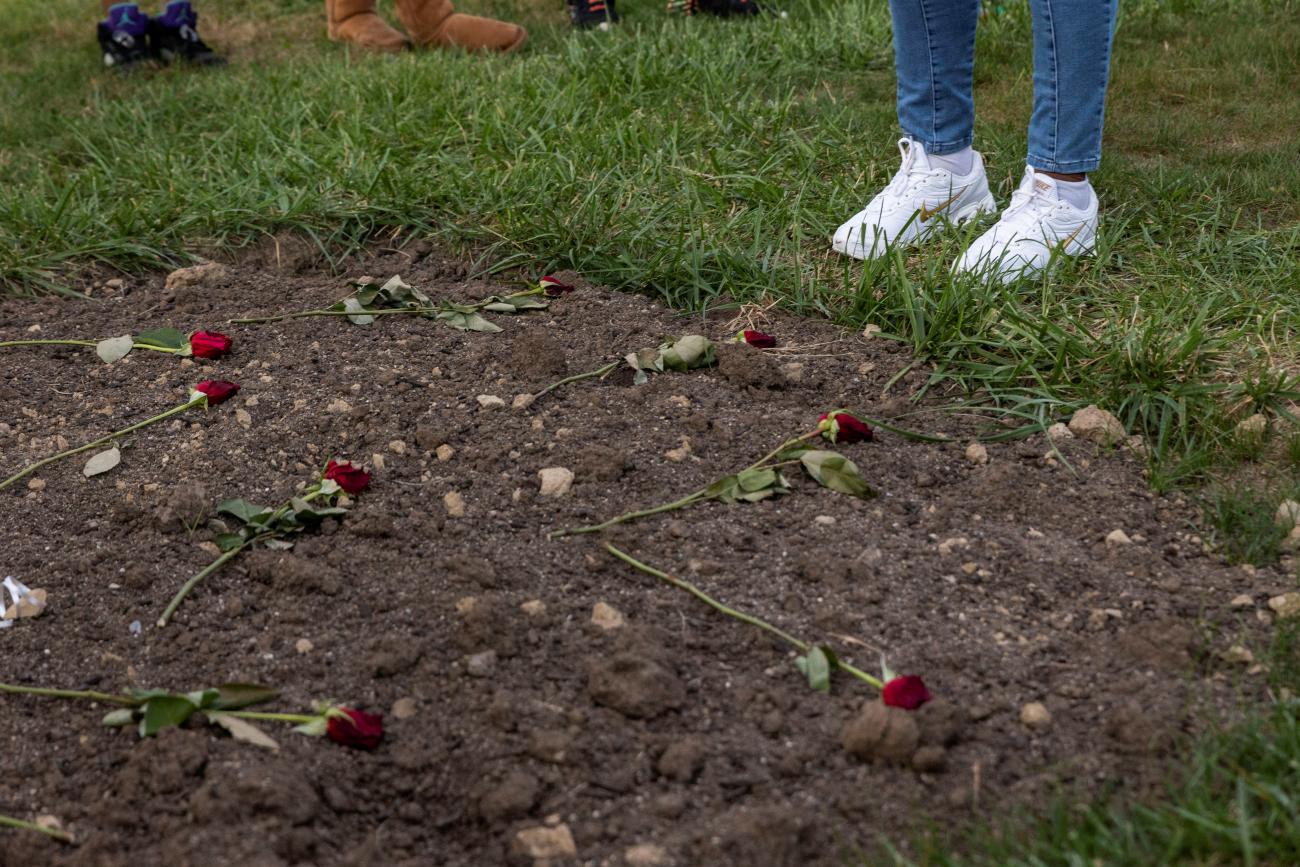 stands in front of the graves of both of her sons with friends and family at Glen Rest Memorial Estate in Reynoldsburg, Ohio, U.S., September 30, 2021. 