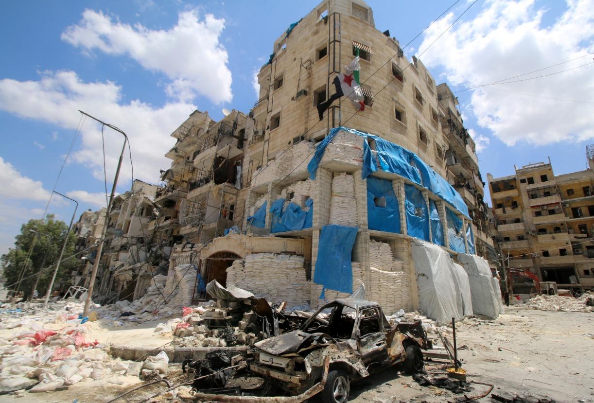 Burnt vehicles are pictured in front of the damaged the Medecins Sans Frontieres (MSF)-backed al-Quds hospital after it was hit by airstrikes, in a rebel-held area of Aleppo, Syria, April 28, 2016.