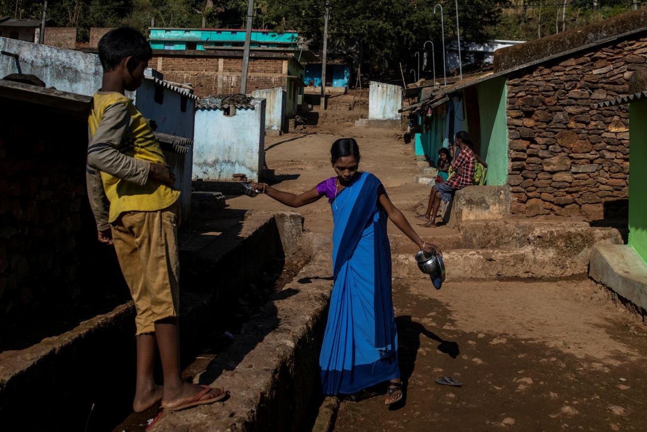  An ASHA health worker, washes her utensils before travelling to Mathalput Community Health Centre to receive the vaccine developed by Oxford/AstraZeneca, in Koraput, India, on  January 16, 2021.