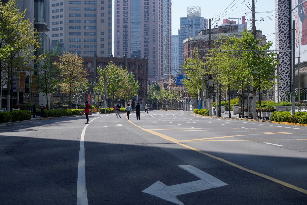 Residents stand on a deserted street waiting for COVID tests during a lockdown in Shanghai, China, on April 17, 2022. 