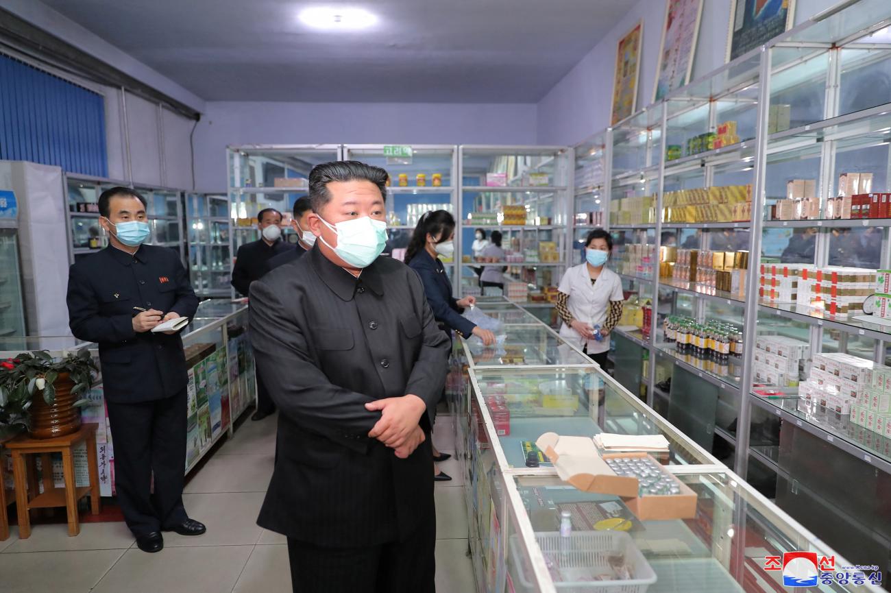 North Korean leader Kim Jong-un inspects a pharmacy in Pyongyang, in this undated photo released by Wearing all black clothing and a face mask, North Korea's Korean Central News Agency (KCNA) on May 15, 2022. 