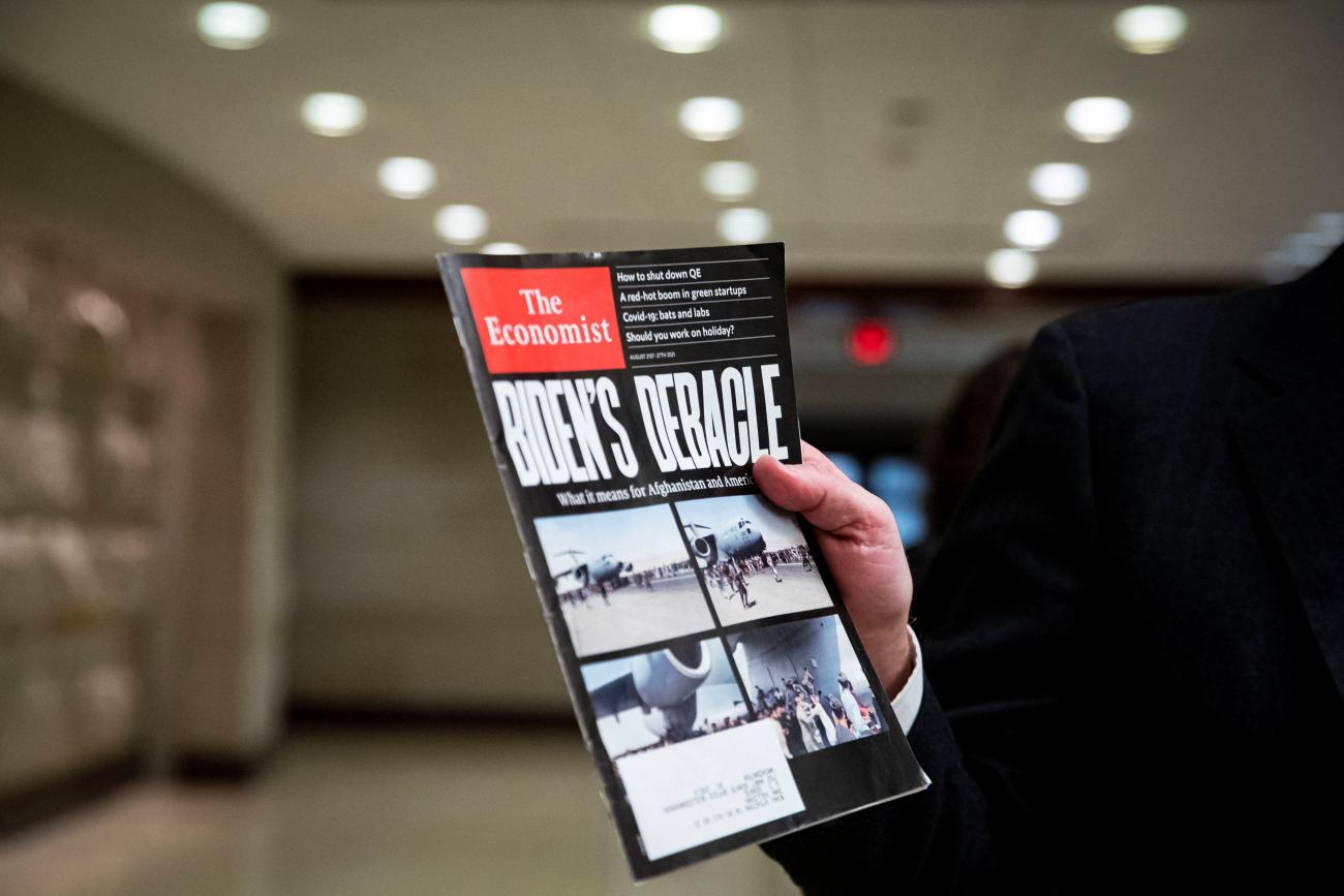 U.S. Senator Dan Sullivan (R-AK) holds a magazine as he speaks to reporters during a break from a Senate Armed Services and Foreign Relations joint briefing on the U.S. policy on Afghanistan, on Capitol Hill in Washington, U.S., February 2, 2022