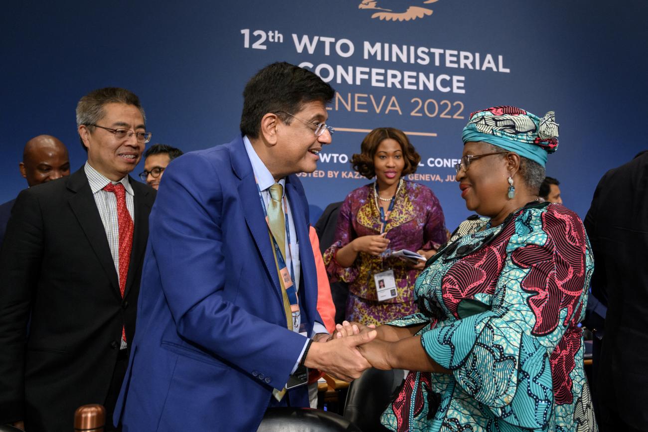 WTO Director-General Ngozi Okonjo-Iweala is congratulated by Indian Minister of Commerce Piyush Goyal after a closing session at the WTO Ministerial Conference in Geneva, Switzerland, on June 17, 2022