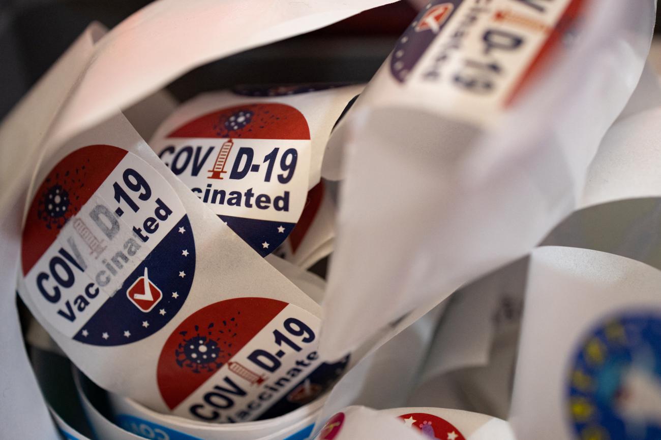 A pile of red, white, and blue stickers for people who receive a COVID-19 booster vaccine targeting BA.4 and BA.5 Omicron subvariants, at Skippack Pharmacy in Schwenksville, Pennsylvania, on September 8, 2022. 