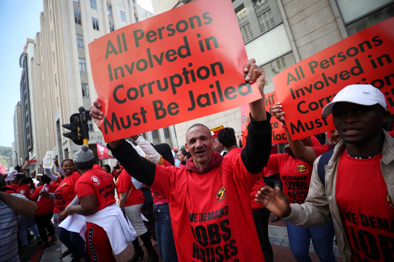 Members of the Congress of South African Trade Unions (COSATU) hold placards as they take part in a nationwide strike over issues including corruption and job losses in Cape Town, South Africa, October 7, 2020.