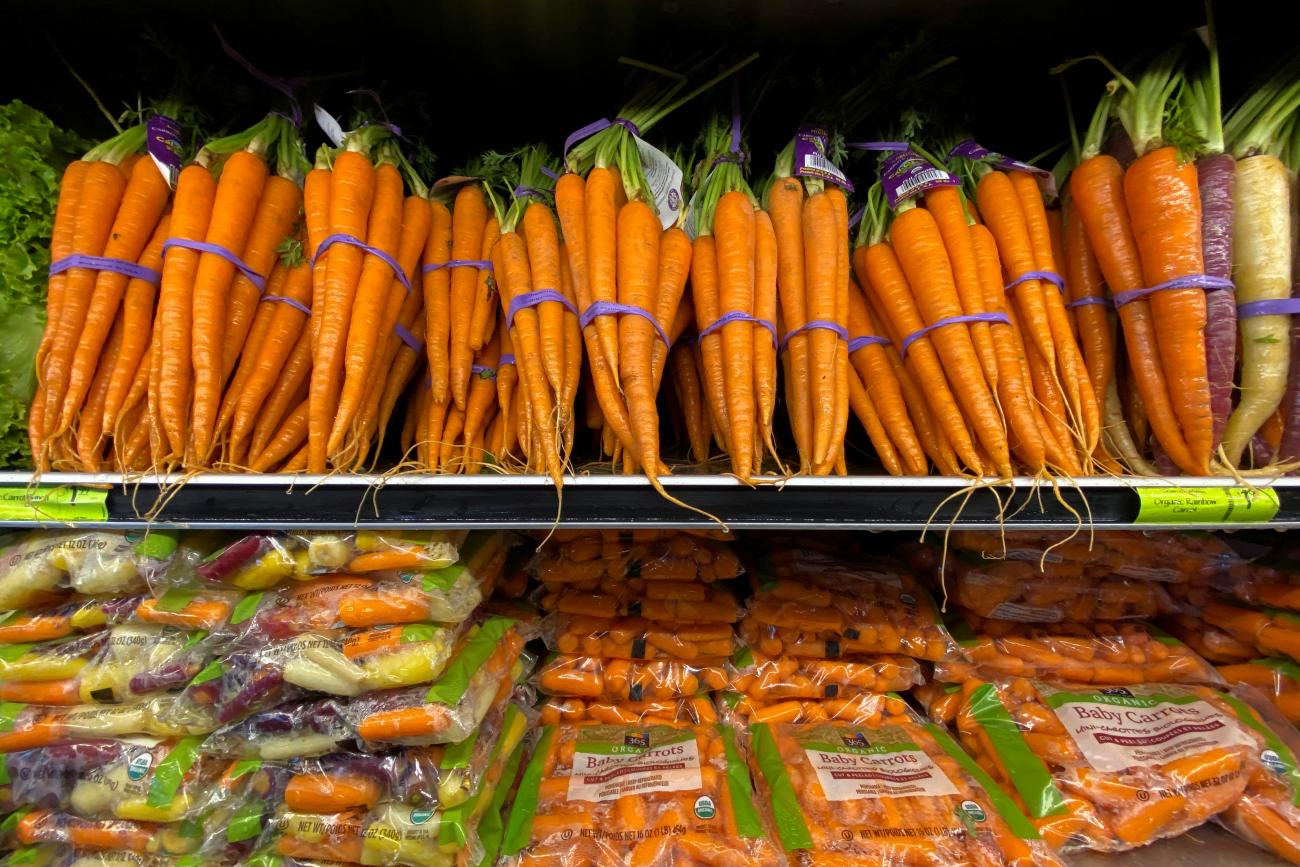 Fresh bright orange carrots are shown on a shelf at a grocery store in Del Mar, California, on June 3, 2020.