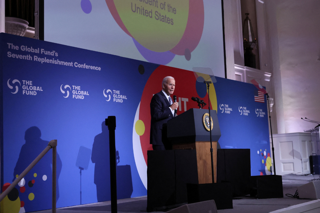 U.S. President Joe Biden stands on a stage in suit and tie and delivers remarks at the Global Fund’s Seventh Replenishment Conference in New York, on September 21, 2022. REUTERS/Leah Millis