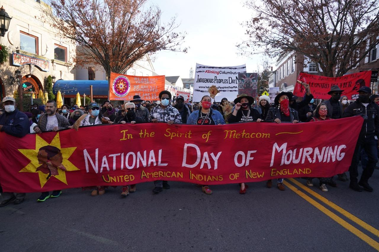 People march during the National Day of Mourning, on Thanksgiving day, November 25, 2021 in Plymouth, Massachusetts.