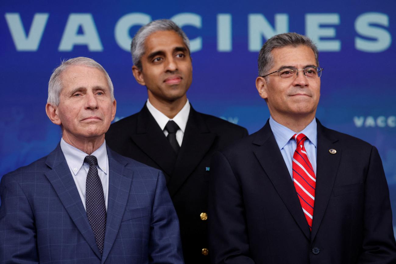 Chief Medical Advisor to the President Anthony Fauci, Surgeon General Vivek Murthy, and Secretary of HHS Xavier Becerra listen as President Joe Biden speaks about COVID-19 at the White House, in Washington, DC, on October 25, 2022. 