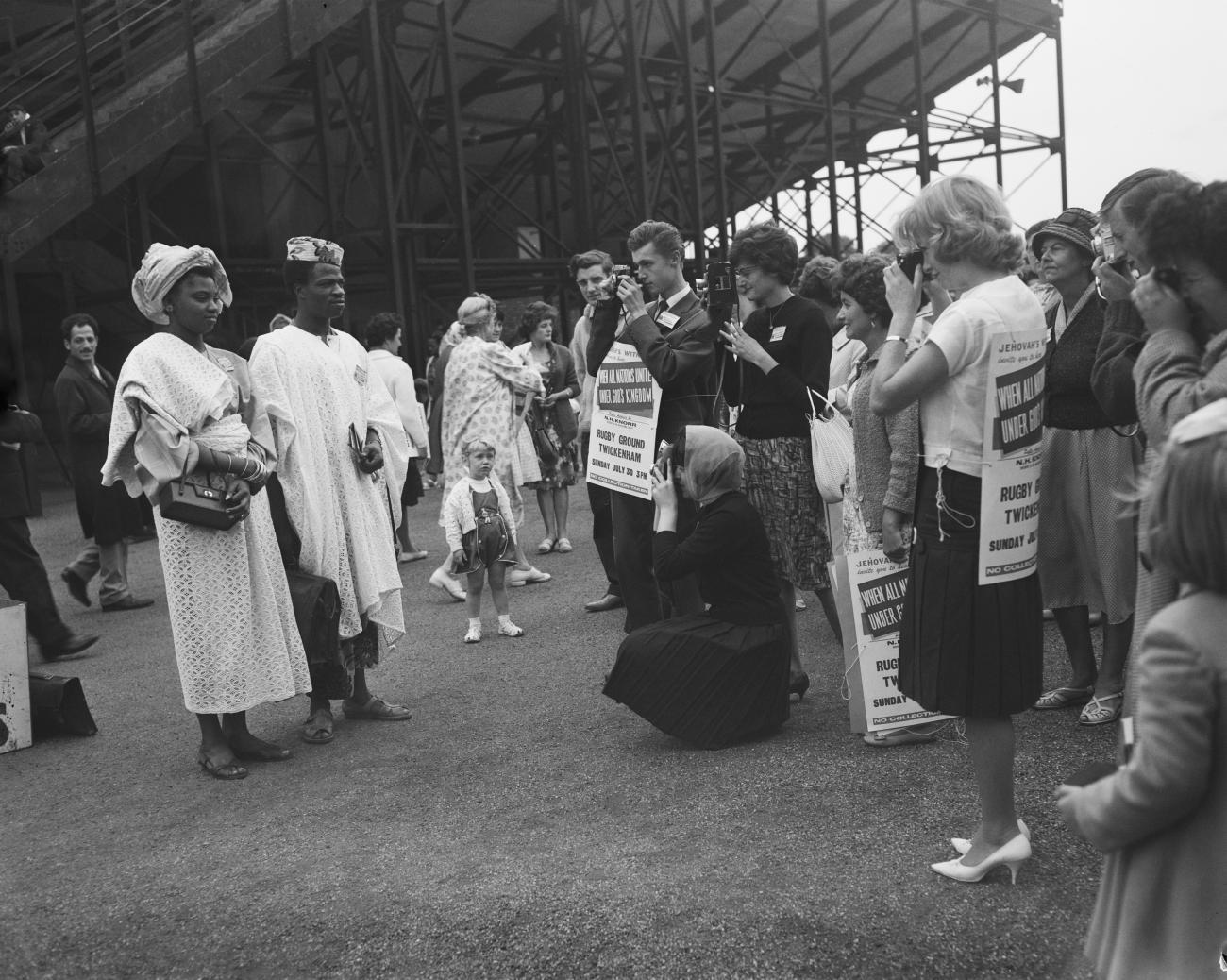 Two Jehovah's Witnesses from Nigeria pose for portraits for fellow worshippers as they attend the United Worshippers Assembly, Twickenham, London, on July 29, 1961. 