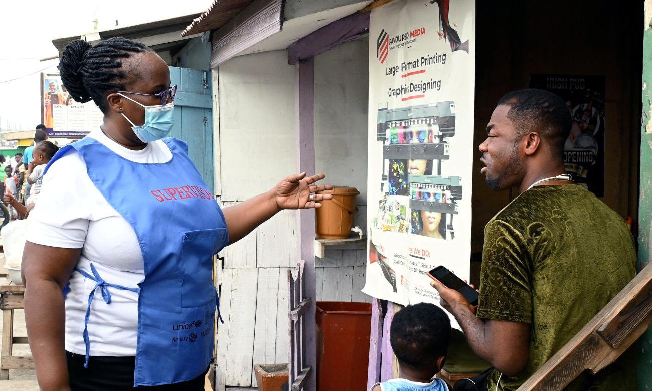 Christina Odei, a health worker from Mamprobi Plolyclinic, offers vaccination to a resident during a mobile vaccination campaign against COVID-19 in Accra, Ghana April 26, 2022.