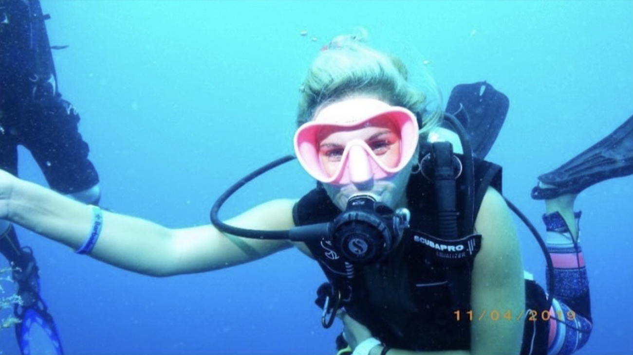 McPhee scuba diving in the ocean before her pregnancy, 2019.