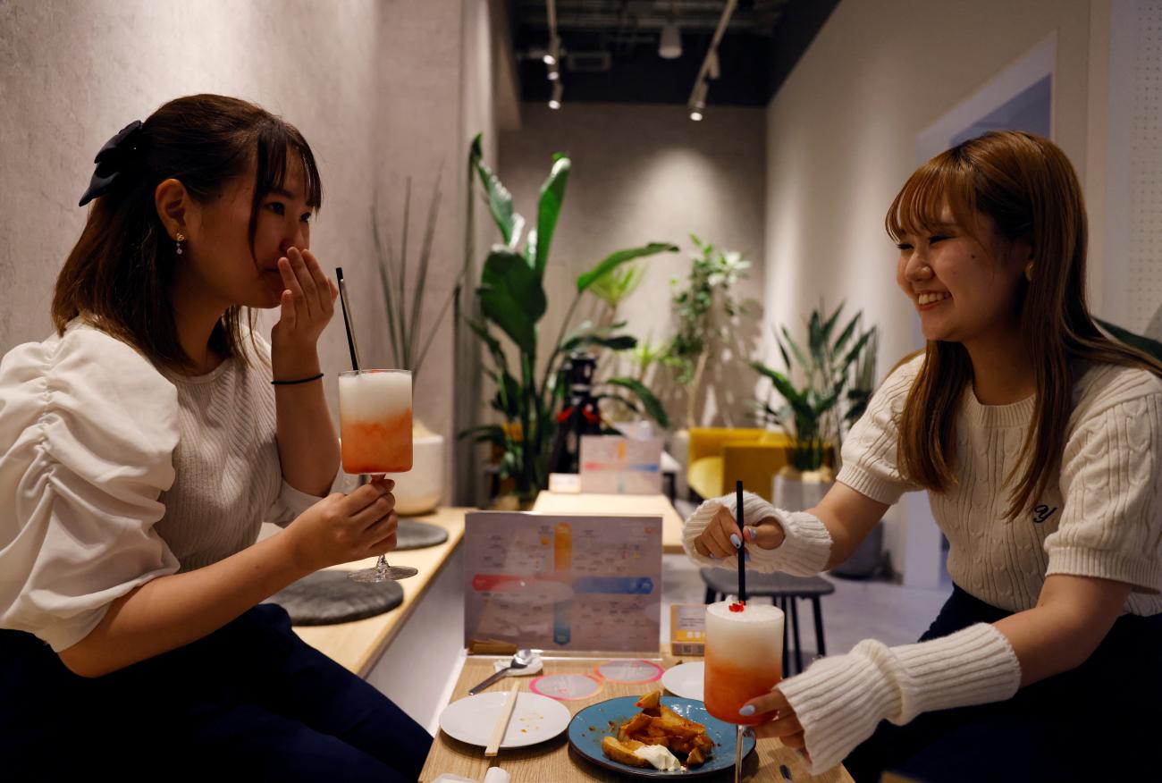 Customers drink cocktails made with no alcohol during a photo opportunity at Sumadori Bar in Tokyo, Japan, on September 2, 2022. 