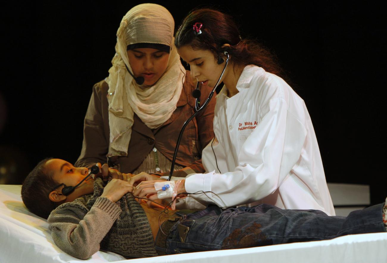 Young cancer patients perform in a play during a cultural event to bring together young cancer survivors and to raise public awareness of childhood cancers, in Amman, Jordan, on February 22, 2010. 