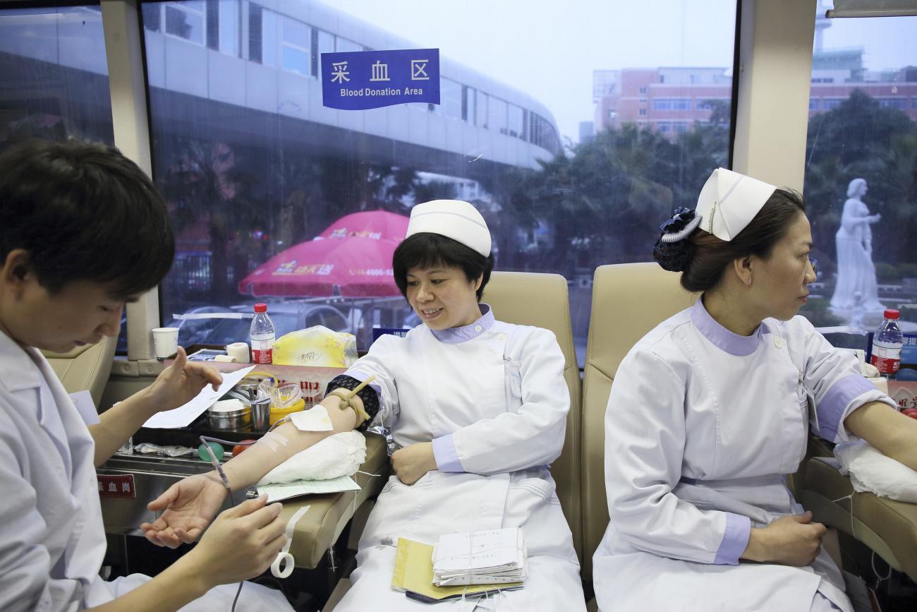 Medical staff donate blood at a hospital in Fuzhou, Fujian province, China, on January 27, 2015.