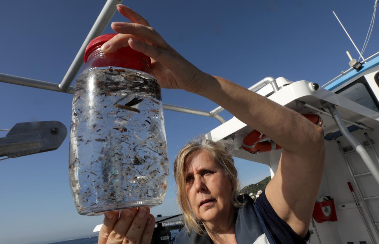Maria-Luiza Pedrotti, CNRS marine biologist specialized in microplastics, looks at sea sample taken from the Mediterraneean Sea on a coastal research vessel as part of a scientific study about microplastics damaging marine ecosystems, near Villefranche-Sur-Mer, on the French Riviera, France, October 19, 2018.