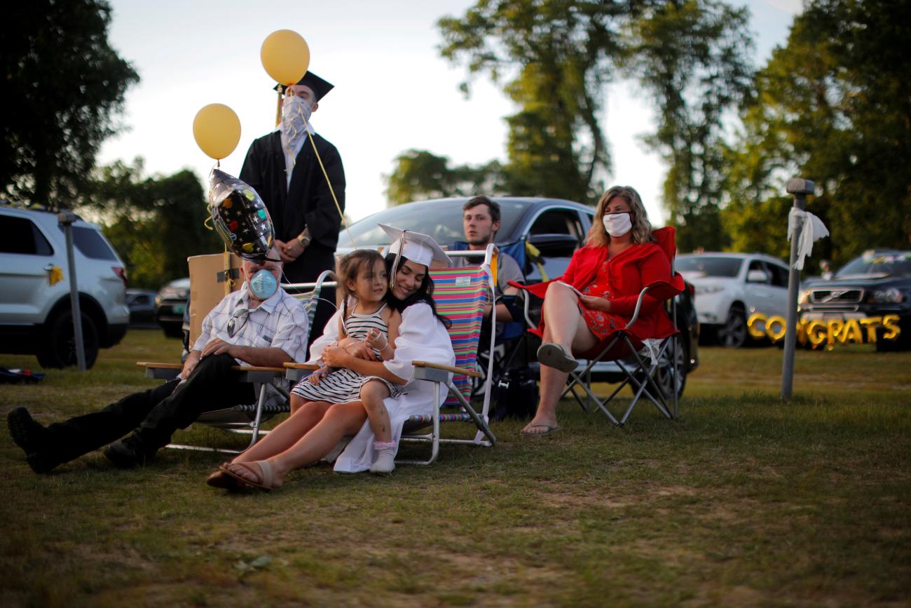 High school senior McKayla Glazier is joined by friends and family during Pioneer Valley Regional School’s graduation, which was held in the Northfield Drive-In Theater because of the coronavirus disease (COVID-19) outbreak, in Hinsdale, New Hampshire, on June 8, 2020. 