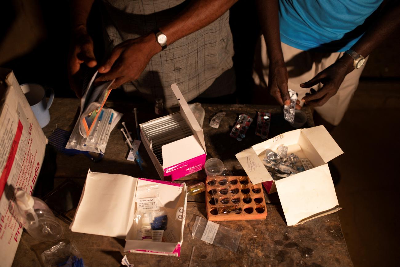 Nurses arrange medicine on a table at a health center in Yakusu, Tshopo, Democratic Republic of Congo, October 2, 2022.