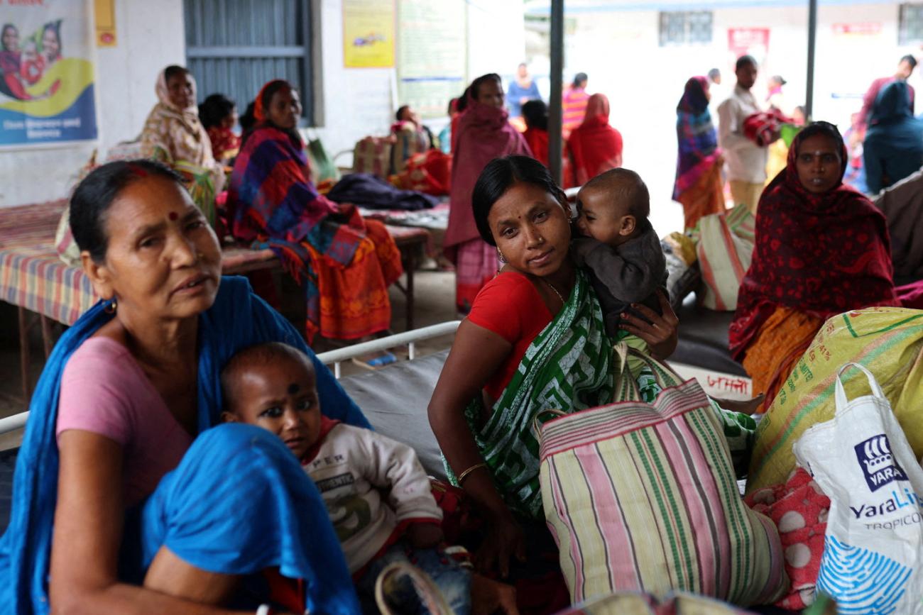 Patients wait outside a primary health care centre in Belwa village, Kishanganj district, Bihar, India, March 20, 2023. 