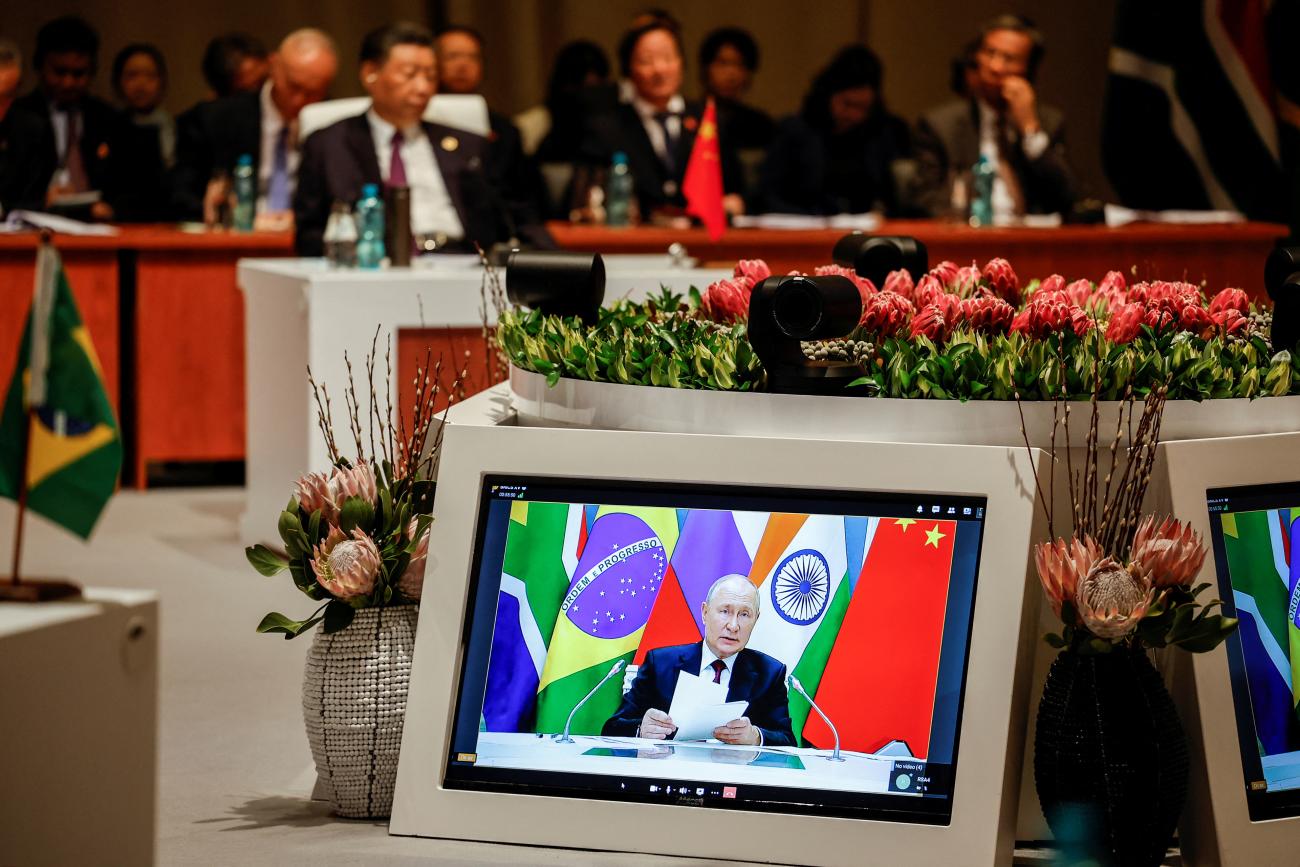President of China Xi Jinping attends the plenary session as Russian President Vladimir Putin delivers his remarks virtually during the 2023 BRICS Summit at the Sandton Convention Centre in Johannesburg, South Africa on August 23, 2023.