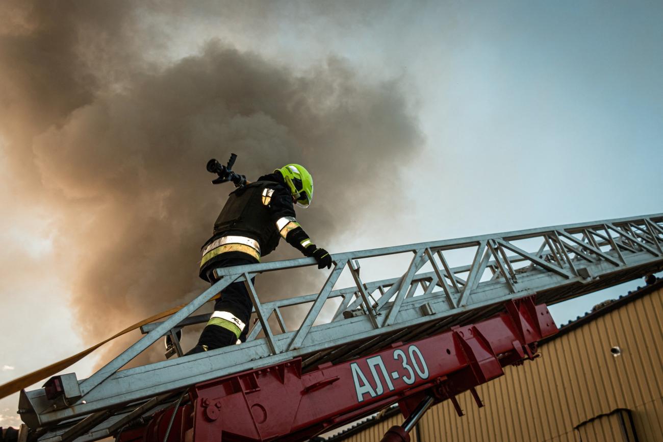 A firefighter works at the site of a damaged building amid Russia's attack on Ukraine, in Kharkiv, Ukraine, September 21, 2023.