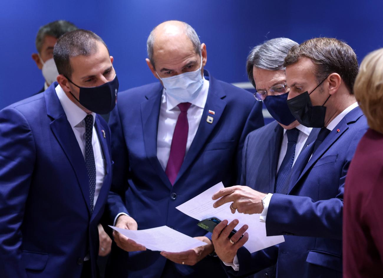 French President Emmanuel Macron, Cypriot President Nicos Anastasiades, Slovenia's Prime Minister Janez Jansa and Malta's Prime Minister Robert Abela, converse at a summit in in Brussels, Belgium.