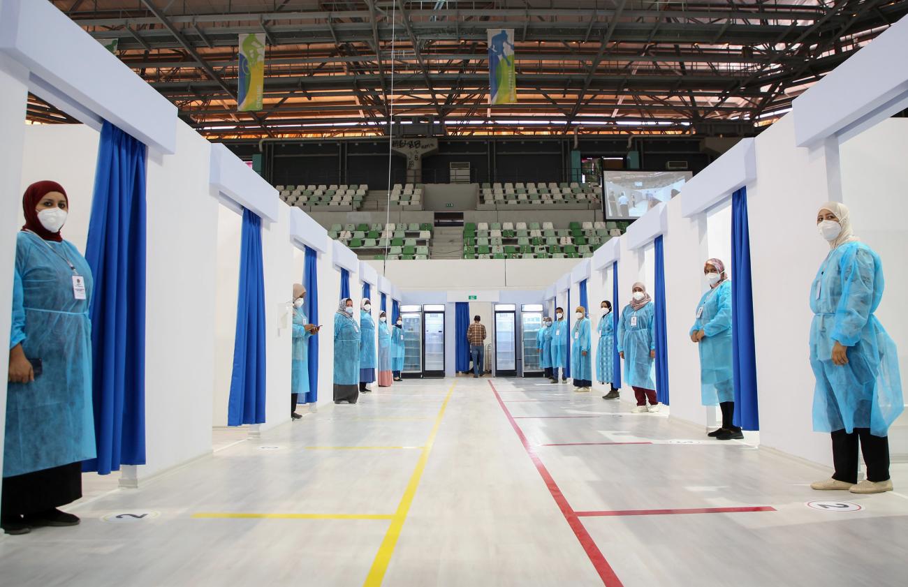 Medical staff stand at the entrance of coronavirus disease (COVID-19) vaccination stations.