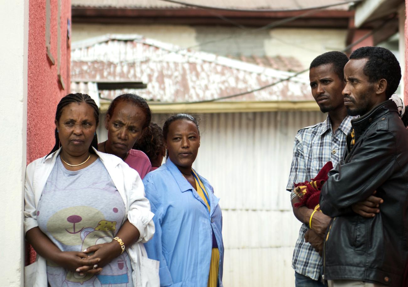 Employees, at a hospital that specializes in ART therapy, listen as U.S. Secretary of State John Kerry speaks during a visit to Gandhi Memorial Hospital in Addis Ababa, Ethiopia, May 1, 2014.