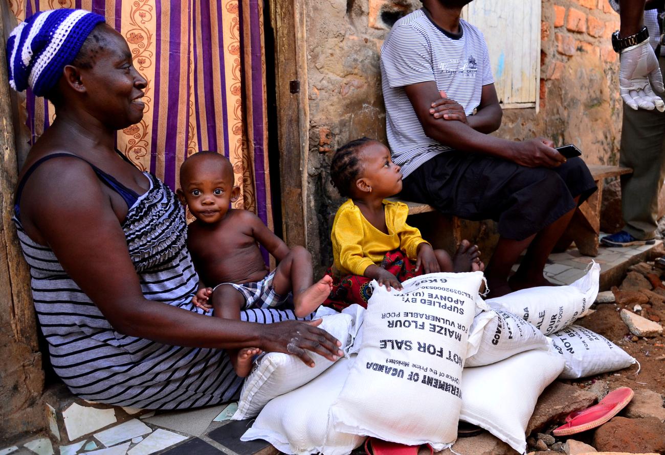 A civilian receives relief food during a government distribution exercise to civilians.