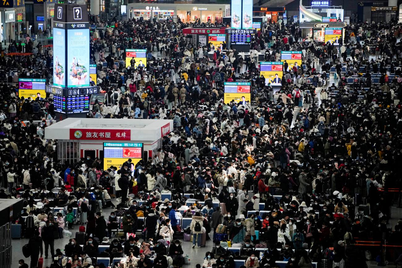 Passengers wait to board trains at Shanghai's Hongqiao Railway Station during the annual Spring Festival travel rush.