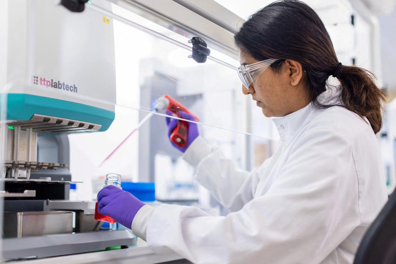 A PhD student works in a lab at the GSK Research and Development center.