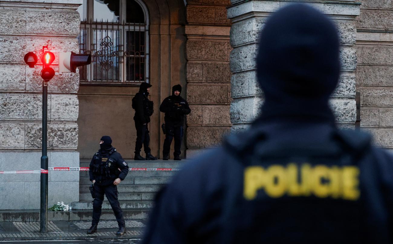 Members of the police stand guard following a shooting at one of Charles University's buildings