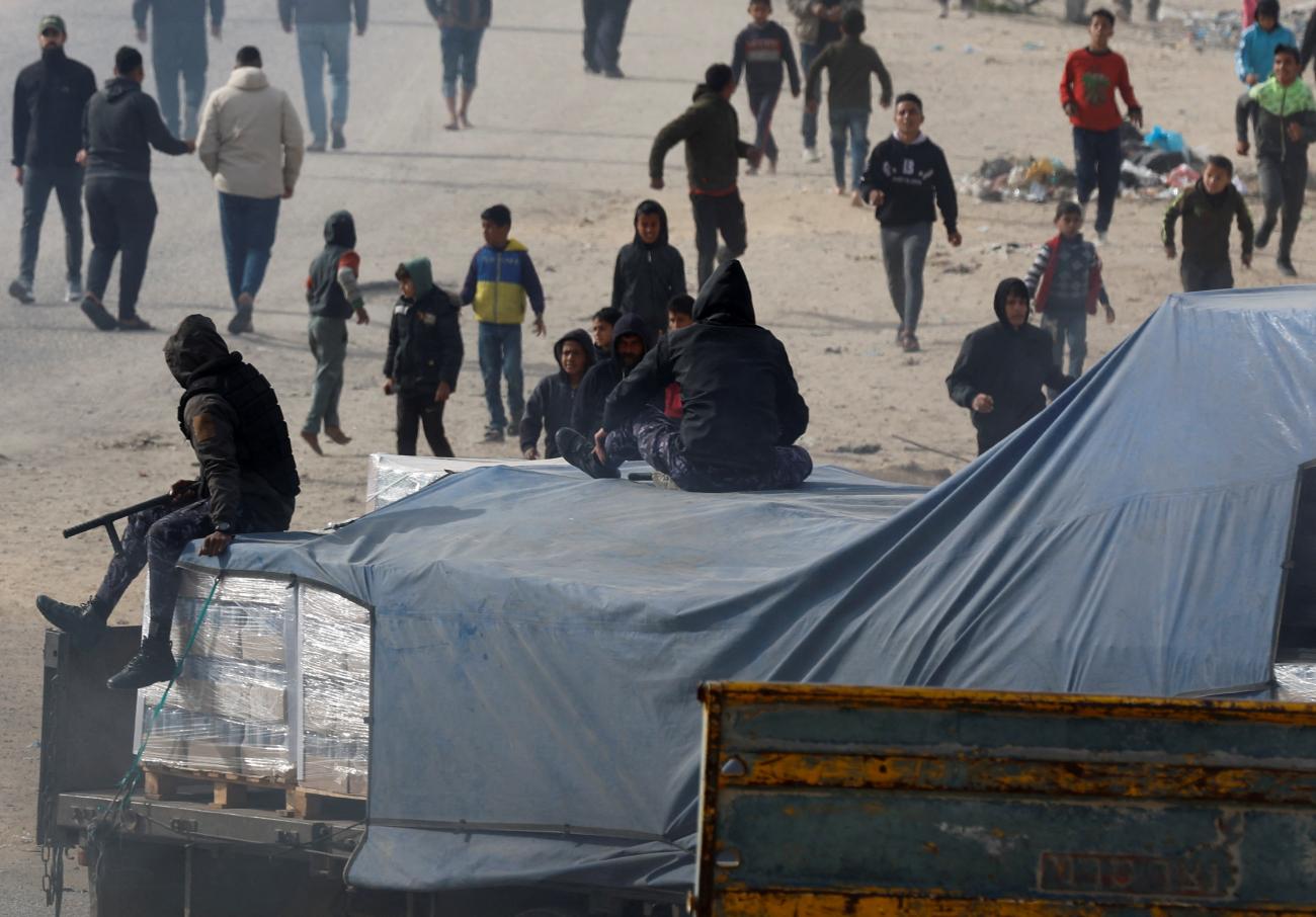 Trucks carrying aid arrive, amid the ongoing conflict between Israel and the Palestinian Islamist group Hamas.