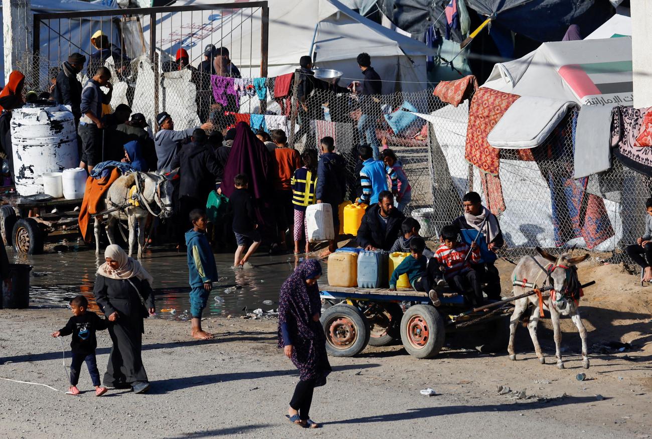 Displaced Palestinians, who fled their houses due to Israeli strikes, shelter at a tent camp.