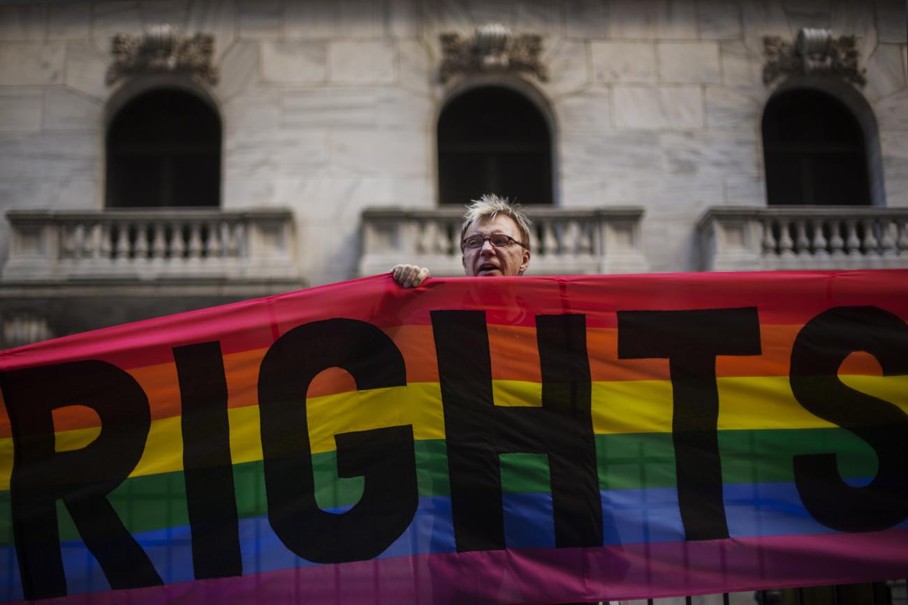 A protester demonstrates against the treatment of lesbian, gay, bisexual, and transgender persons.