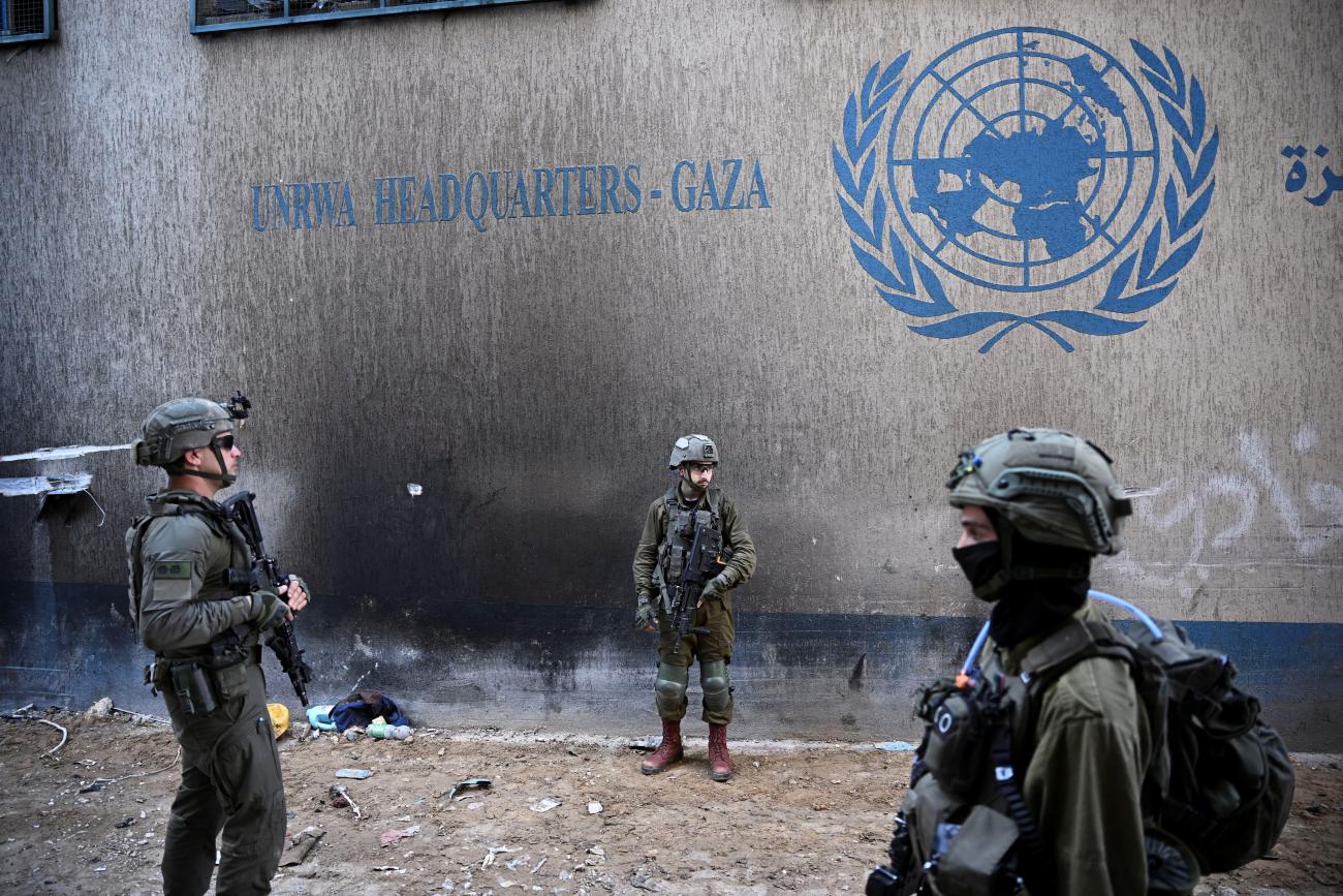 Israeli soldiers operate next to the UNRWA headquarters, amid the ongoing conflict between Israel and Hamas.