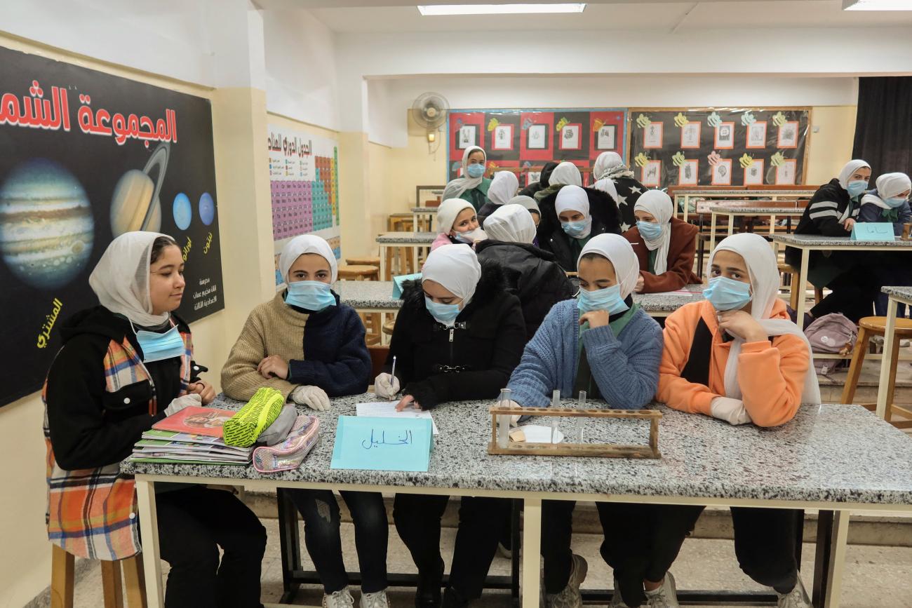 Students attend a classroom at a school run by UNRWA at Amman new camp.