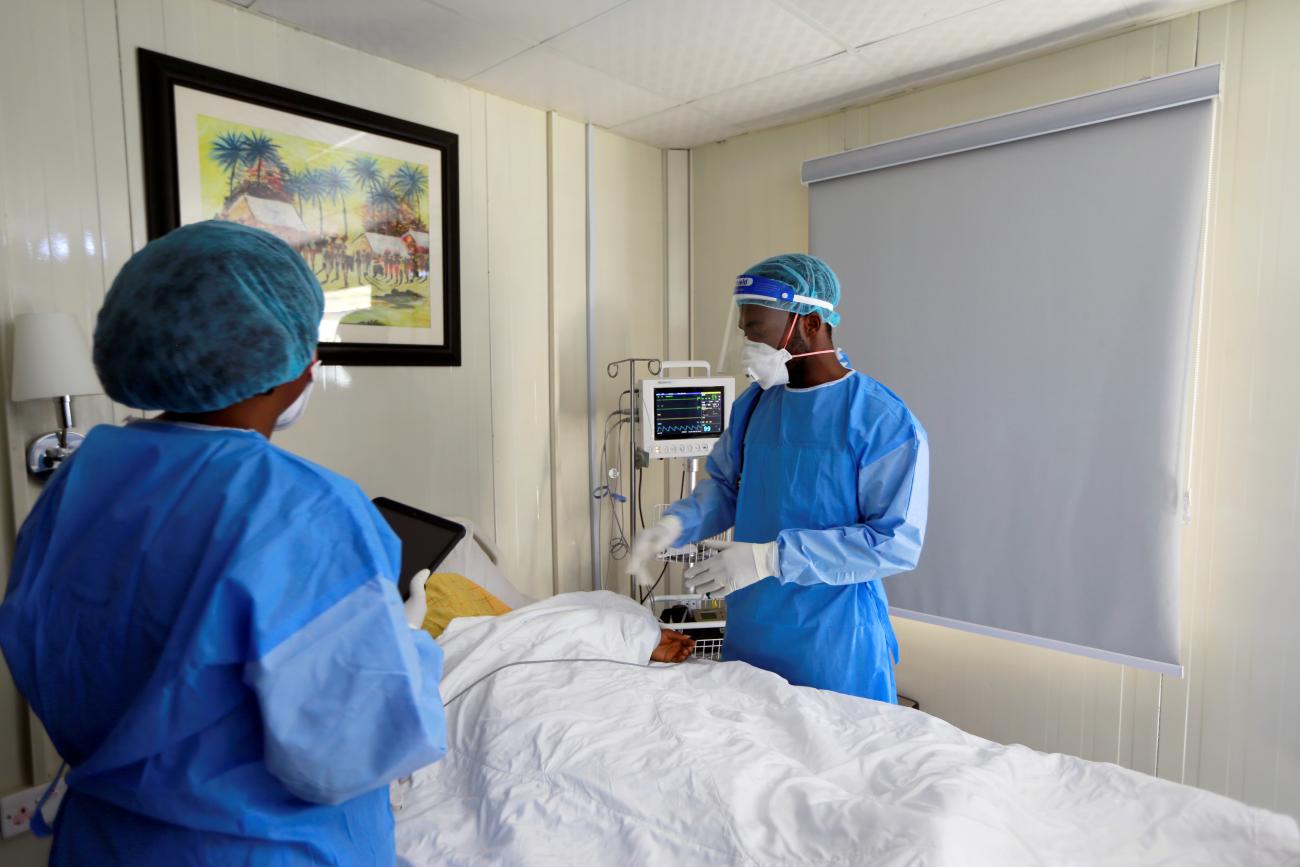 Doctor Oluwajoba Oroge attends to a patient at EHA Clinics.