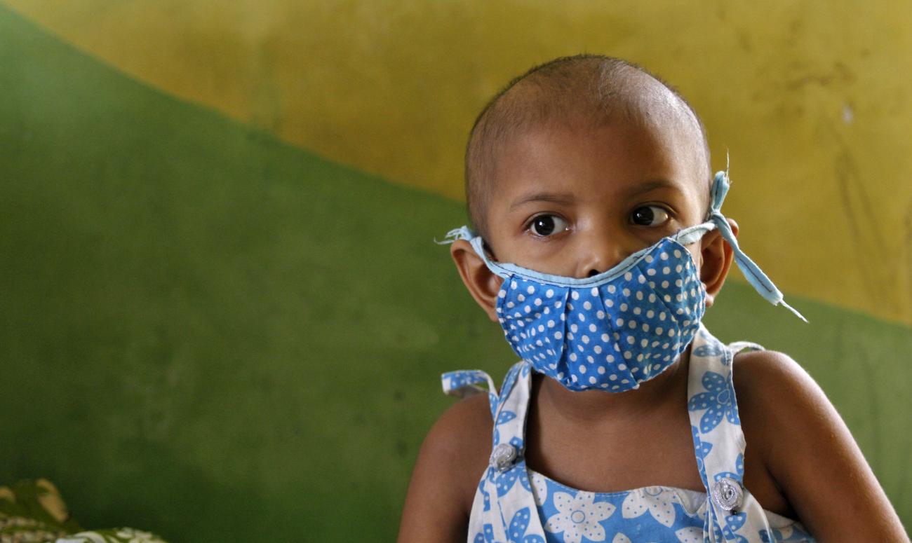 A girl suffering from cancer rests inside the children's ward at the Cancer Centre Welfare Home and Research Institute.